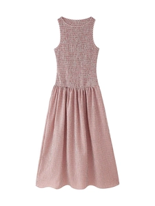 Detail of red gingham midi dress showing smocked bodice and round neckline texture