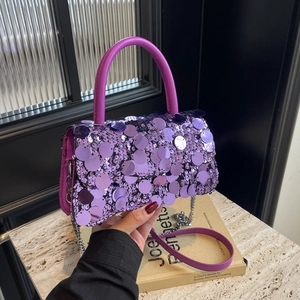 Detail of purple sequin handbag with PU leather handle and metal chain strap