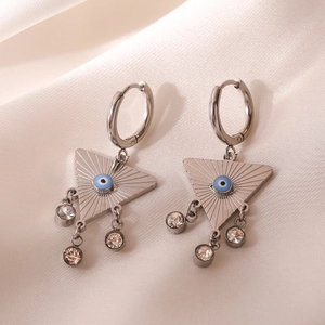 Silver hoop earrings with evil eye triangle charms and zircon drops on silk