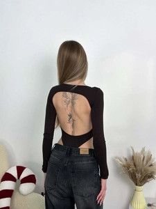 Detail view of the deep open back design on this black long sleeve ribbed bodysuit