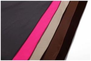 Detailed fabric texture of high-stretch yoga jumpsuits in various neutral and neon colors