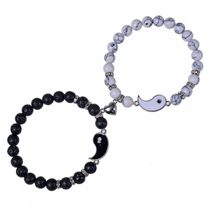 Detail of Yin Yang bead bracelets with heart magnet connector and stone textures