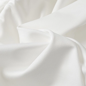 Close-up of high-quality white mesh fabric with fine twill texture and soft folds