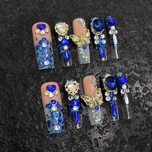 Handmade long coffin press-on nails with blue butterfly charms and heart rhinestones