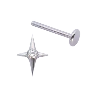 Detail of G23 titanium star labret stud featuring a clear zircon and flat back base