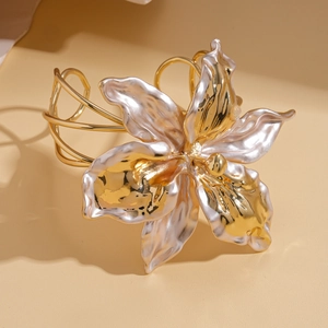 Dramatic metallic flower cuff bracelet with gold and pearl white floral petal details