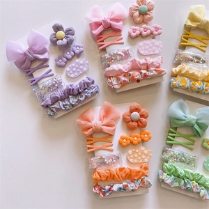 Vibrant 6-piece kids floral bow hairclip set with colorful fabric scrunchies on white cards