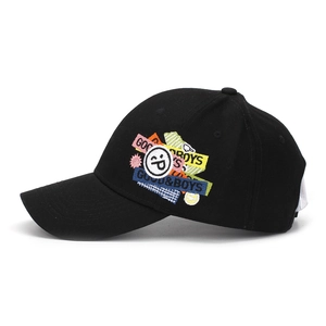 Detail of colorful smiley face embroidery and 'GOOD&BOYS' text on a black baseball cap