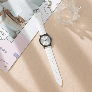 Minimalist white silicone strap watch with silver brushed dial and blue hands for women