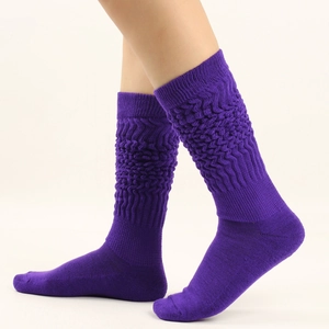 Detail of purple slouch socks showing thick knitted texture and ribbed cotton layers