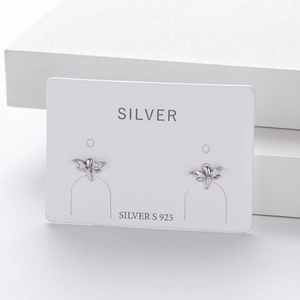 Macro shot of S925 sterling silver dragonfly stud earrings with sparkling cubic zirconia