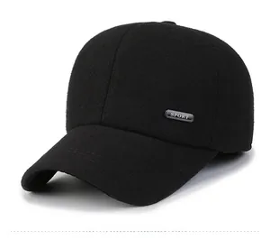 Detail view of winter baseball cap with 'SPORT' silver emblem and thick wool-like fabric