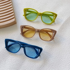 Kids trendy hollow cat eye sunglasses in green, beige, and navy for fashion streetwear