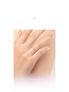 Macro shot of minimalist hollow star pattern on a silver open ring worn on fingers