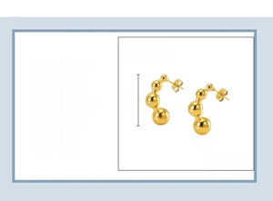 Detailed view of C-shaped bean bead earrings in 18k gold plated stainless steel