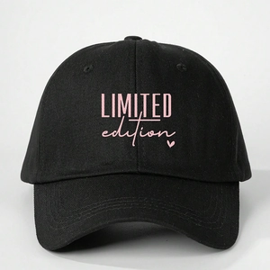 Black cotton baseball cap with pink LIMITED edition text and small heart embroidery