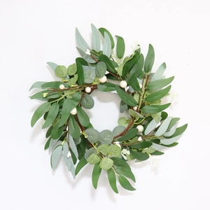 Detail of eucalyptus leaves, willow leaves and white berries on a 30cm candle ring