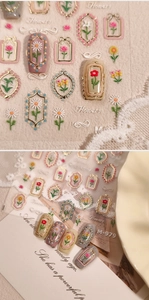 Close-up of 3D embossed flower nail stickers with gold borders and rose floral patterns