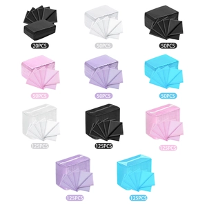 Waterproof disposable nail table mats in various colors and pack sizes for salons