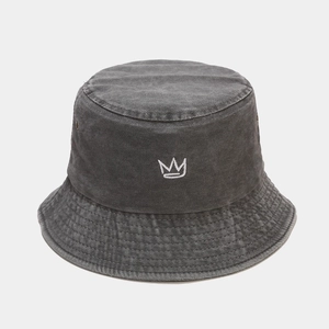 Detail of crown embroidery on charcoal washed cotton bucket hat with vintage texture