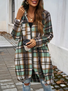 Detail of hooded plaid jacket featuring a metal zipper and soft flannel texture