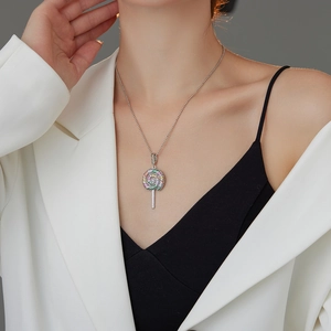 Detail of colorful cubic zirconia lollipop pendant on a silver beaded chain necklace
