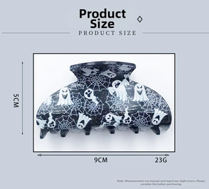 Ghost and spider web hair claw clip detail with 9cm width and 5cm height dimensions