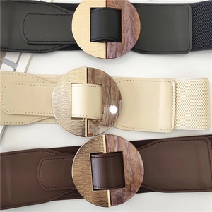 Three elastic waist belts in black, beige, and brown with marble metal buckles