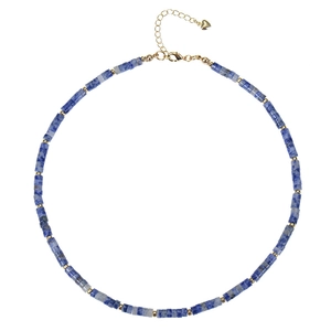 Detail of turquoise beaded necklace featuring gold spacers, lobster clasp and heart charm