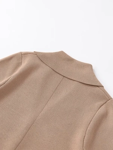 Detailed close-up of knit lapel stitching and collar seam on khaki short sleeve cardigan