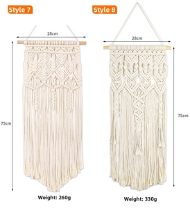 Detail of bohemian handmade cotton woven wall hanging with wooden beam and tassels