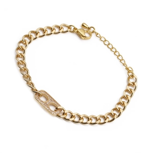 Adjustable gold plated curb chain bracelet with zircon pavé oval link on white background