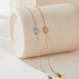 Detailed close-up of crown bracelets in gold and silver finish with sparkling tiny crystals