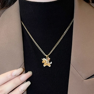 Luxurious gold unicorn necklace with red gemstone eye on double chain for women