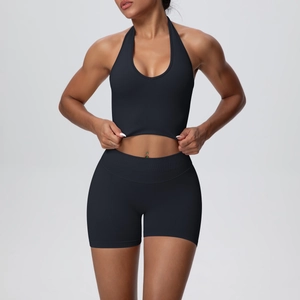 Front view of black halter yoga set with high waist compression shorts and ribbed support