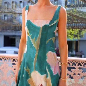 Detail of square neckline and vintage floral print on green summer midi dress