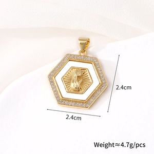 Close-up of gold hexagonal pendant with praying hands and white shell inlay detail