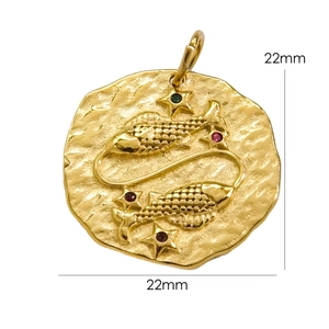 Macro view of 22mm 14K gold stainless steel Pisces pendant with hammered texture and gems