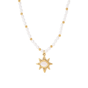 Vintage pearl necklace with golden sunburst pendant and opal center on white background