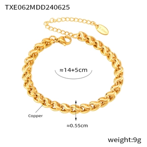 Macro shot of gold twist chain bracelet with size labels and lobster clasp details