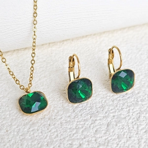 Close-up of emerald square zircon necklace and earrings set in gold stainless steel