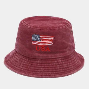Detail of embroidered USA flag on washed cotton burgundy bucket hat with ventilation eyelet