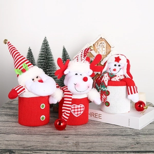 Three Christmas character candy jars featuring Santa, elk, and snowman holiday decor