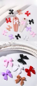 Macro detail of multi-color 3D resin bow nail charms for professional DIY manicure art