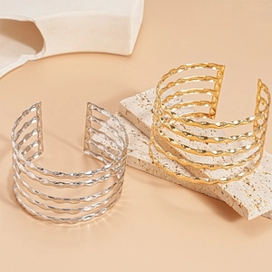 Metallic multi-layer open cuff bracelet with wavy texture in gold and silver finish