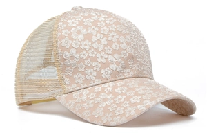 Detail of floral lace embroidery and breathable mesh on a summer trucker hat