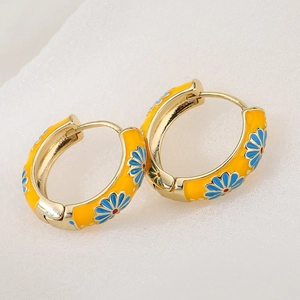 Yellow enamel daisy flower hoop earrings with gold plating in a summer candy style