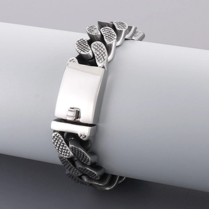 Detailed view of silver stainless steel Cuban link bracelet with a heavy safety clasp
