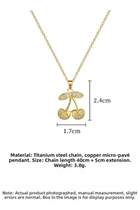 Detail of gold cherry pendant necklace showing dimensions and titanium steel chain specs