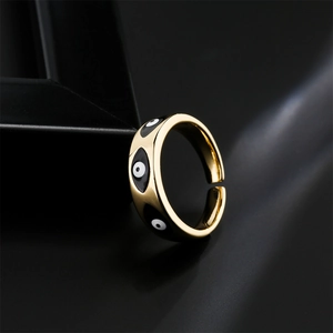 Gold plated evil eye open ring with black enamel details and adjustable band